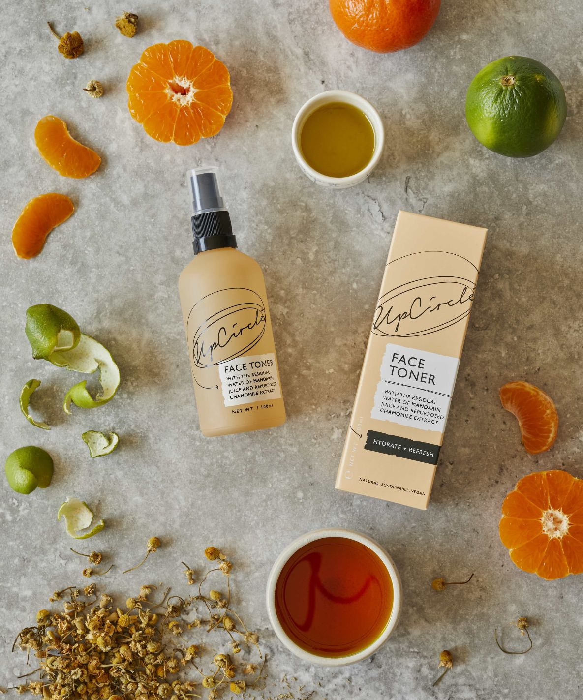 UpCircle Beauty products with fruit and flowers