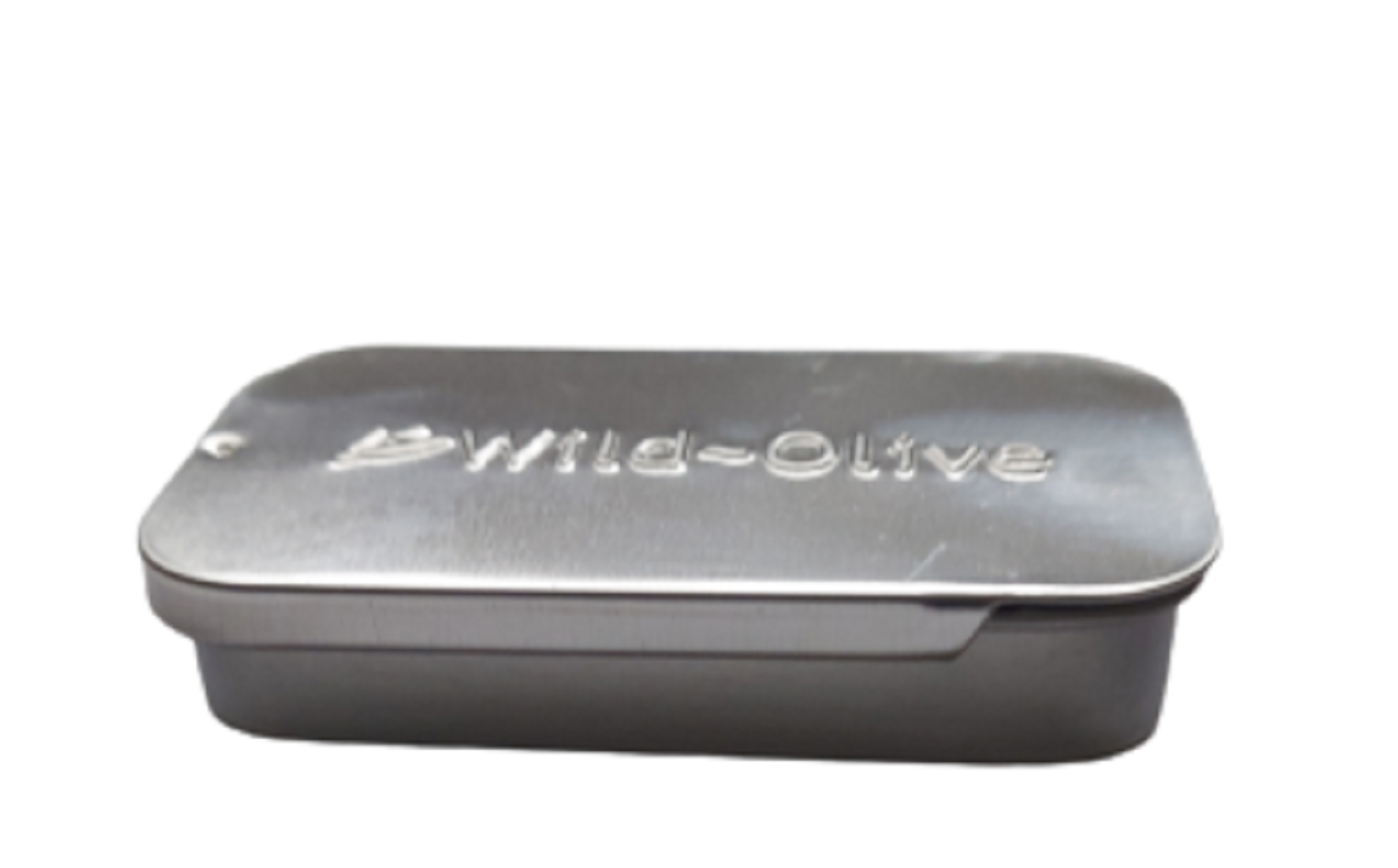 Silver tin with 'Wild Olive' branding on a white background