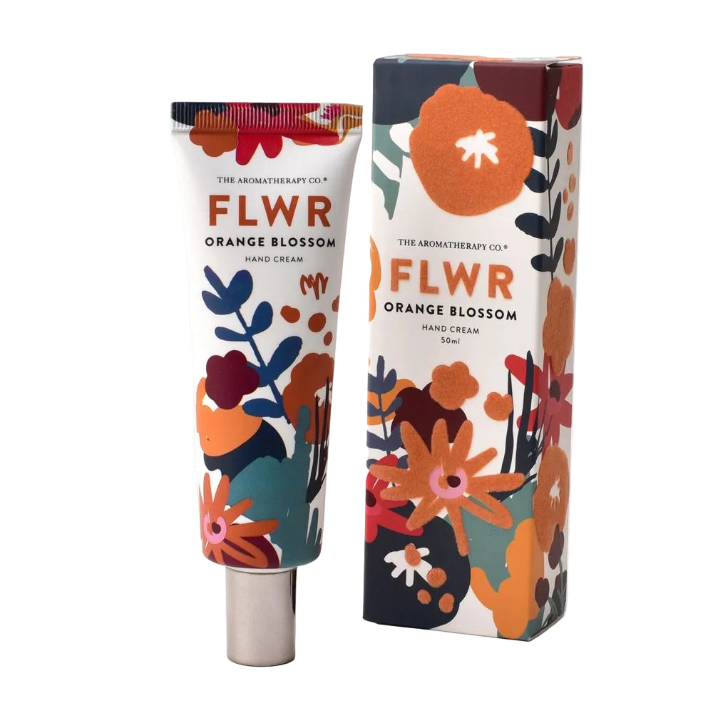 The Aromatherapy Co. FLWR Orange Blossom Hand Cream packaging and tube with floral designs in shades of orange, brown, and white.